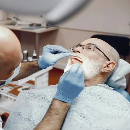 old man sitting dentist s office 2